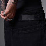 JEANS BAGGY CORTE DIAGONAL NEGRO